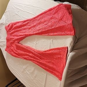 Neon pink lace swimsuit cover.